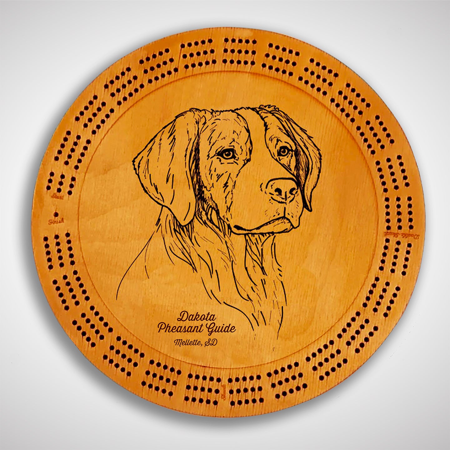 Crafted from high-quality wood, and featuring a laser-engraved Brittany Spaniel, this cribbage board allows you to bring memories of your outdoor adventures to your game. Enjoy the nostalgic feel and endless entertainment of this premium board. Show off your love for sporting dogs while honing your cribbage skills. Perfect for any cabin or game room! A Dakota Pheasant Guide souvenir.