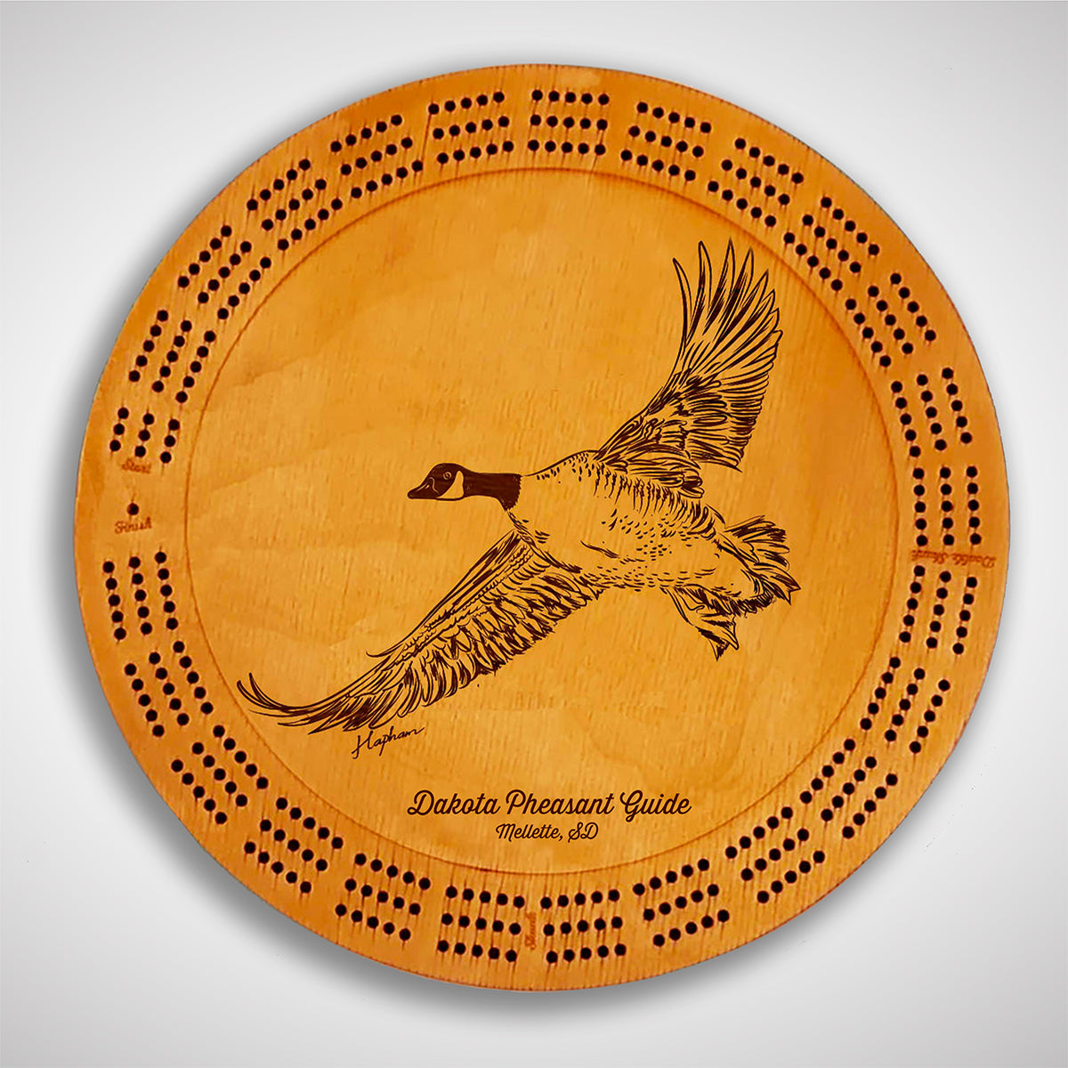 Crafted from high-quality wood, and featuring a laser-engraved Canada Goose in flight, this cribbage board allows you to bring memories of your outdoor adventures to your game. Enjoy the nostalgic feel and endless entertainment of this premium board. Show off your love for waterfowl and game birds while honing your cribbage skills. Perfect for any cabin or game room! A Dakota Pheasant Guide souvenir.