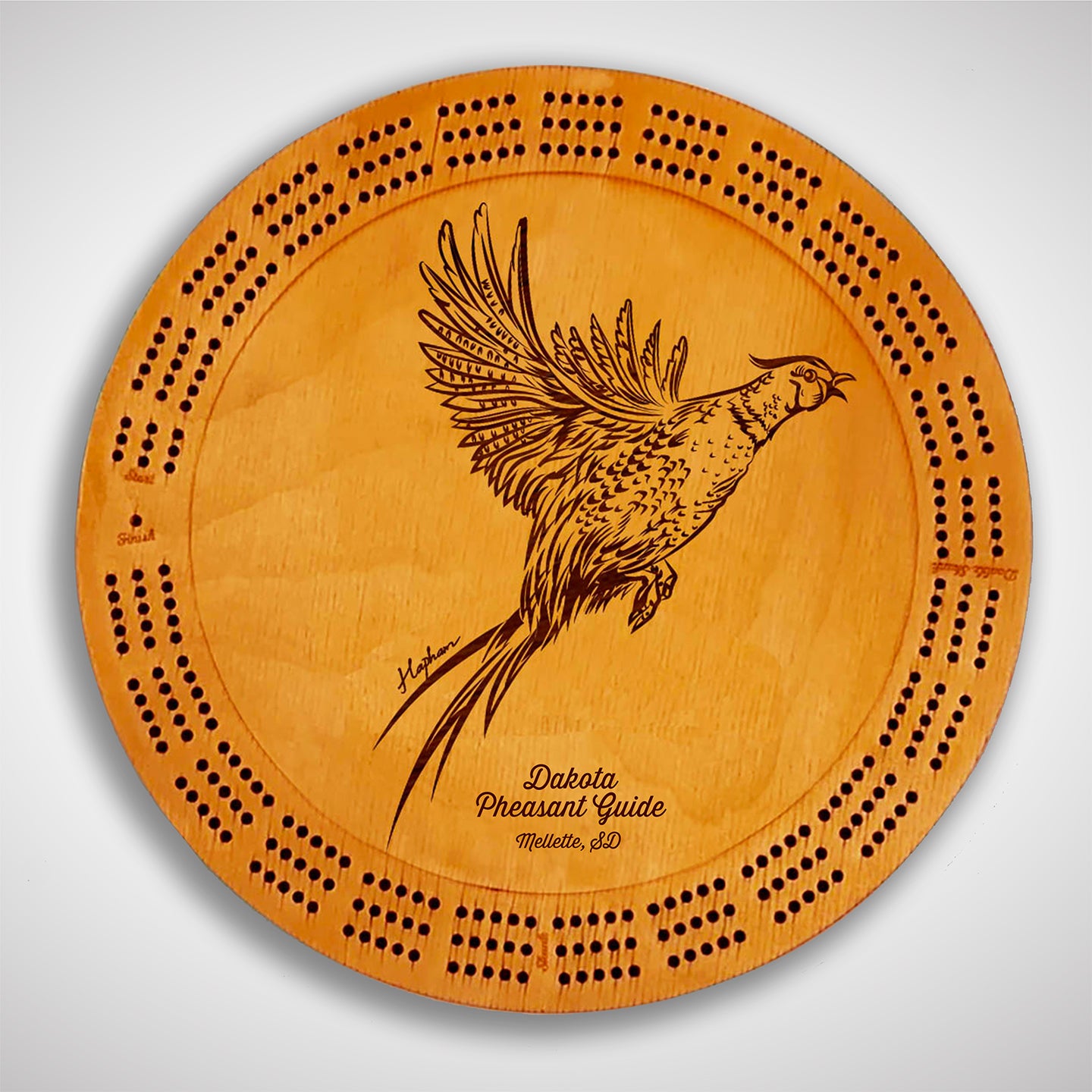 Crafted from high-quality wood, and featuring a laser-engraved Pheasant taking flight, this cribbage board allows you to bring memories of your outdoor adventures to your game. Enjoy the nostalgic feel and endless entertainment of this premium board. Show off your love for game birds while honing your cribbage skills. Perfect for any cabin or game room! A Dakota Pheasant Guide souvenir.