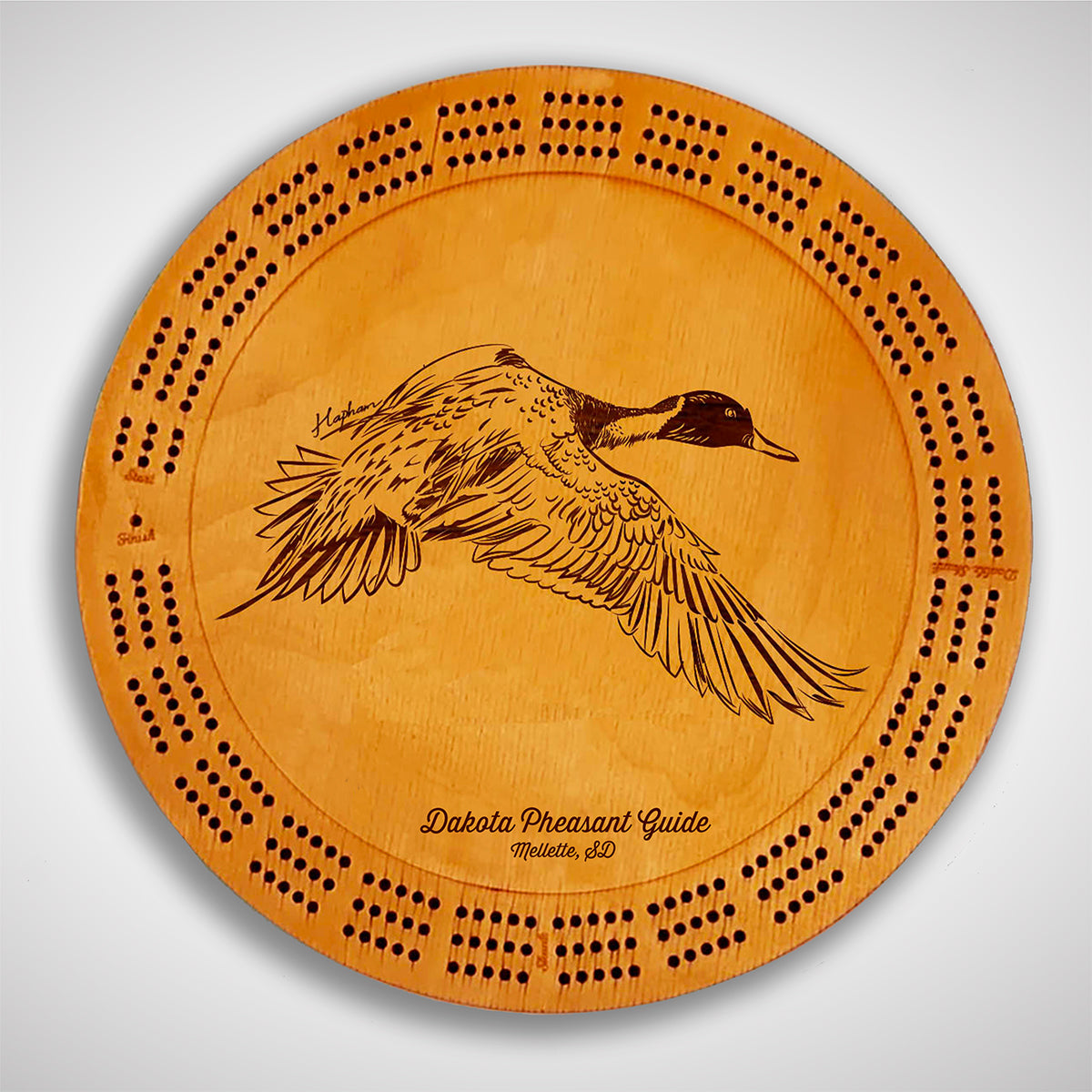 Crafted from high-quality wood, and featuring a laser-engraved Pintail Duck in flight, this cribbage board allows you to bring memories of your outdoor adventures to your game. Enjoy the nostalgic feel and endless entertainment of this premium board. Show off your love for waterfowl and game birds while honing your cribbage skills. Perfect for any cabin or game room! A Dakota Pheasant Guide souvenir.