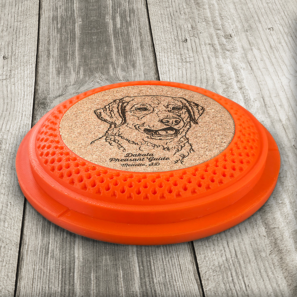 Clay Pigeon shaped coaster base with a laser-engraved cork insert featuring a Chesapeake Bay Retriever - this set of 4 coasters makes a unique gift for any trap shooter, gun enthusiast and bird dog lover! By Muggins Gifts for the Dakota Pheasant Guide Souvenir shop.