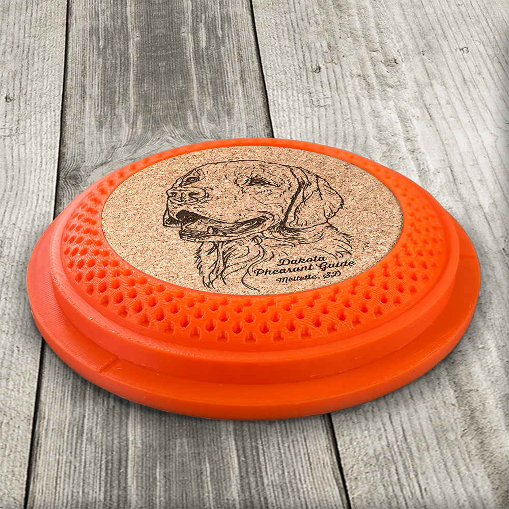 Clay Pigeon shaped coaster base with a laser-engraved cork insert featuring a Golden Retriever - this set of 4 coasters makes a unique gift for any trap shooter, gun enthusiast and bird dog lover! By Muggins Gifts for the Dakota Pheasant Guide Souvenir shop.