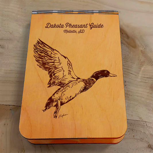 Featuring a laser-engraved Mallard Duck taking flight, this small wooden crib board is an ideal gift and travel companion for any game bird and waterfowl hunting enthusiast. Enjoy hours of fun on the go, and make your next adventure memorable with our Travel Crib Board! A Dakota Pheasant Guide souvenir.