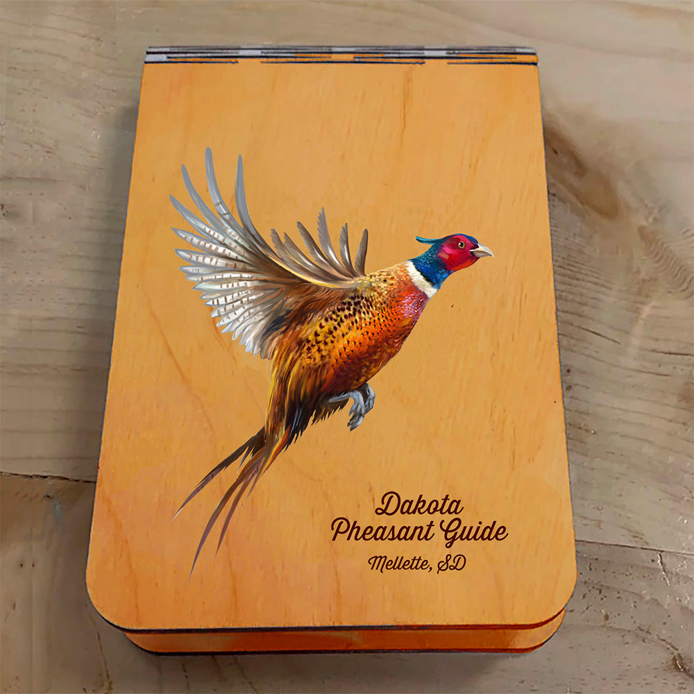 Featuring a colorful painting of a Pheasant taking flight, this small wooden crib board is an ideal gift and travel companion for any game bird and hunting enthusiast. Enjoy hours of fun on the go, and make your next adventure memorable with our Travel Crib Board! A Dakota Pheasant Guide souvenir.