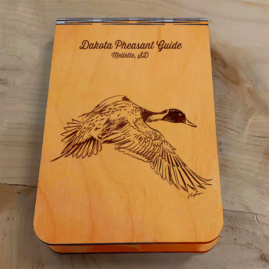 Featuring a laser-engraved Pintail Duck in flight, this small wooden crib board is an ideal gift and travel companion for any game bird and waterfowl hunting enthusiast. Enjoy hours of fun on the go, and make your next adventure memorable with our Travel Crib Board! A Dakota Pheasant Guide souvenir.