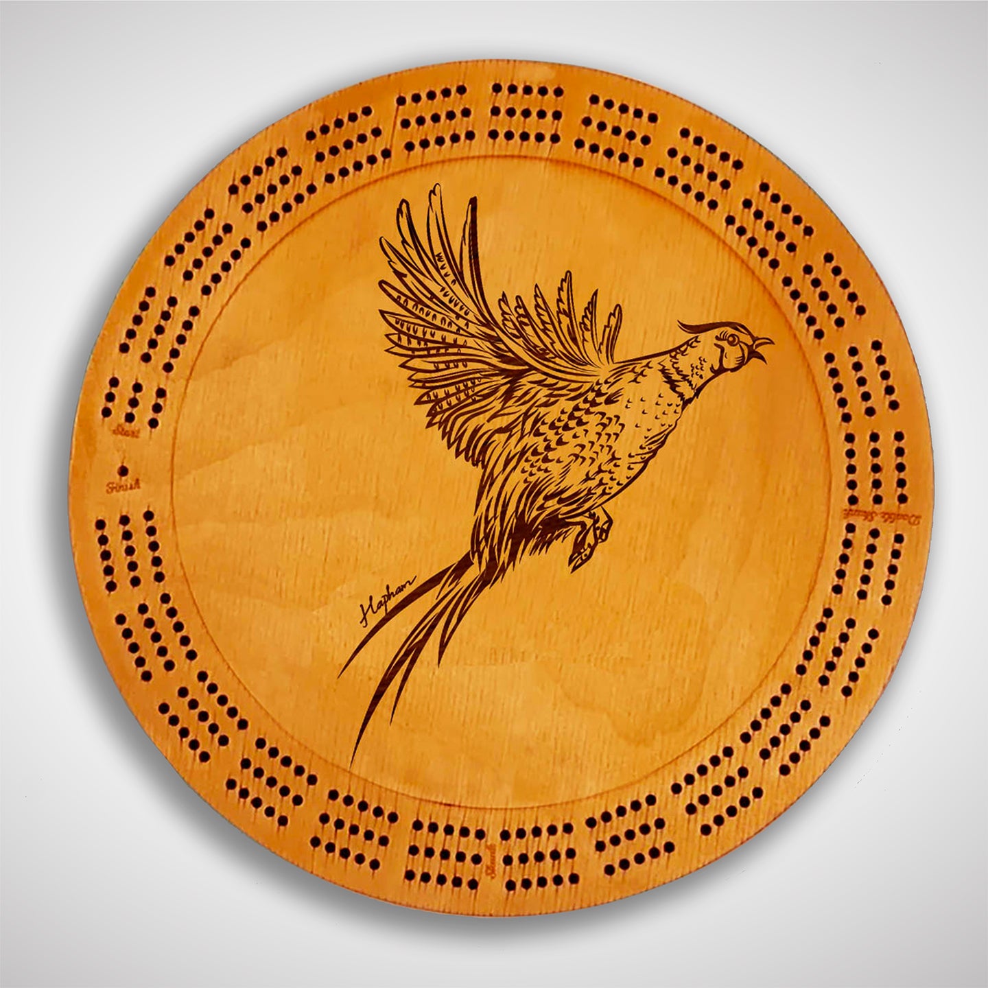 Crafted from high-quality wood, and featuring a laser-engraved Pheasant taking flight, this cribbage board allows you to bring memories of your outdoor adventures to your game. Enjoy the nostalgic feel and endless entertainment of this premium board. Show off your love for game birds while honing your cribbage skills. Perfect for any cabin or game room! A Dakota Pheasant Guide souvenir.