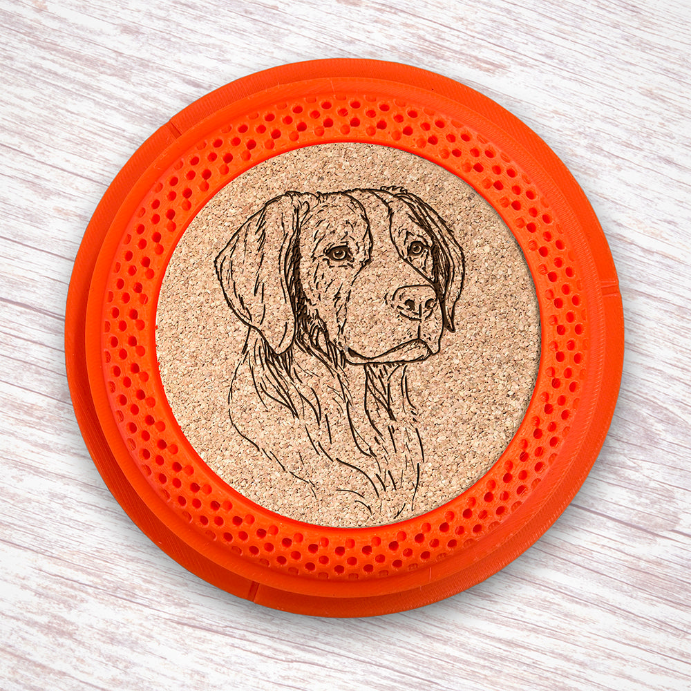 Clay Pigeon shaped coaster base with a laser-engraved cork insert featuring a Brittany Spaniel - this set of 4 coasters makes a unique gift for any trap shooter, gun enthusiast and bird dog lover! By Muggins Gifts for the Dakota Pheasant Guide Souvenir shop.