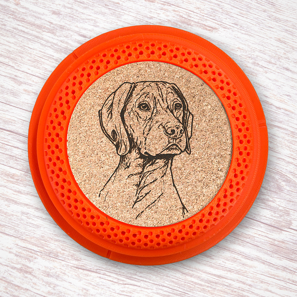 Clay Pigeon shaped coaster base with a laser-engraved cork insert featuring a German Shorthair Pointer - this set of 4 coasters makes a unique gift for any trap shooter, gun enthusiast and bird dog lover! By Muggins Gifts for the Dakota Pheasant Guide Souvenir shop.