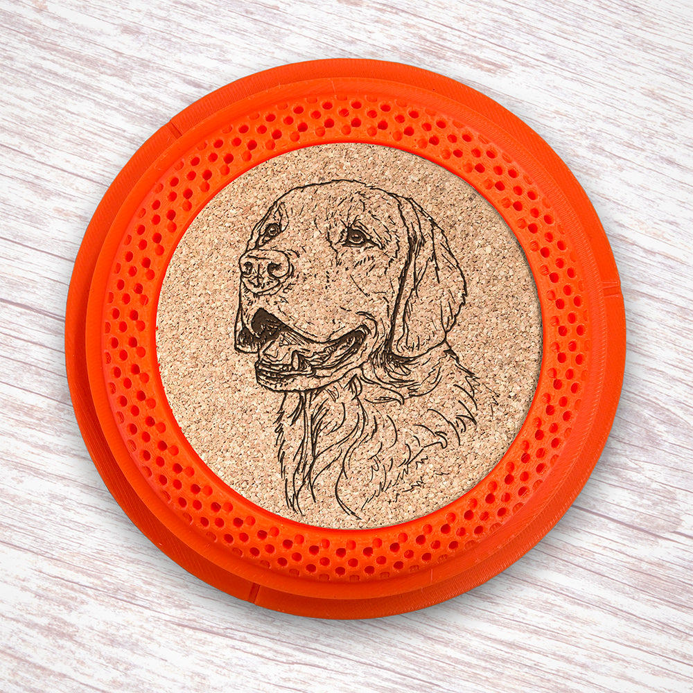 Clay Pigeon shaped coaster base with a laser-engraved cork insert featuring a Golden Retriever - this set of 4 coasters makes a unique gift for any trap shooter, gun enthusiast and bird dog lover! By Muggins Gifts for the Dakota Pheasant Guide Souvenir shop.