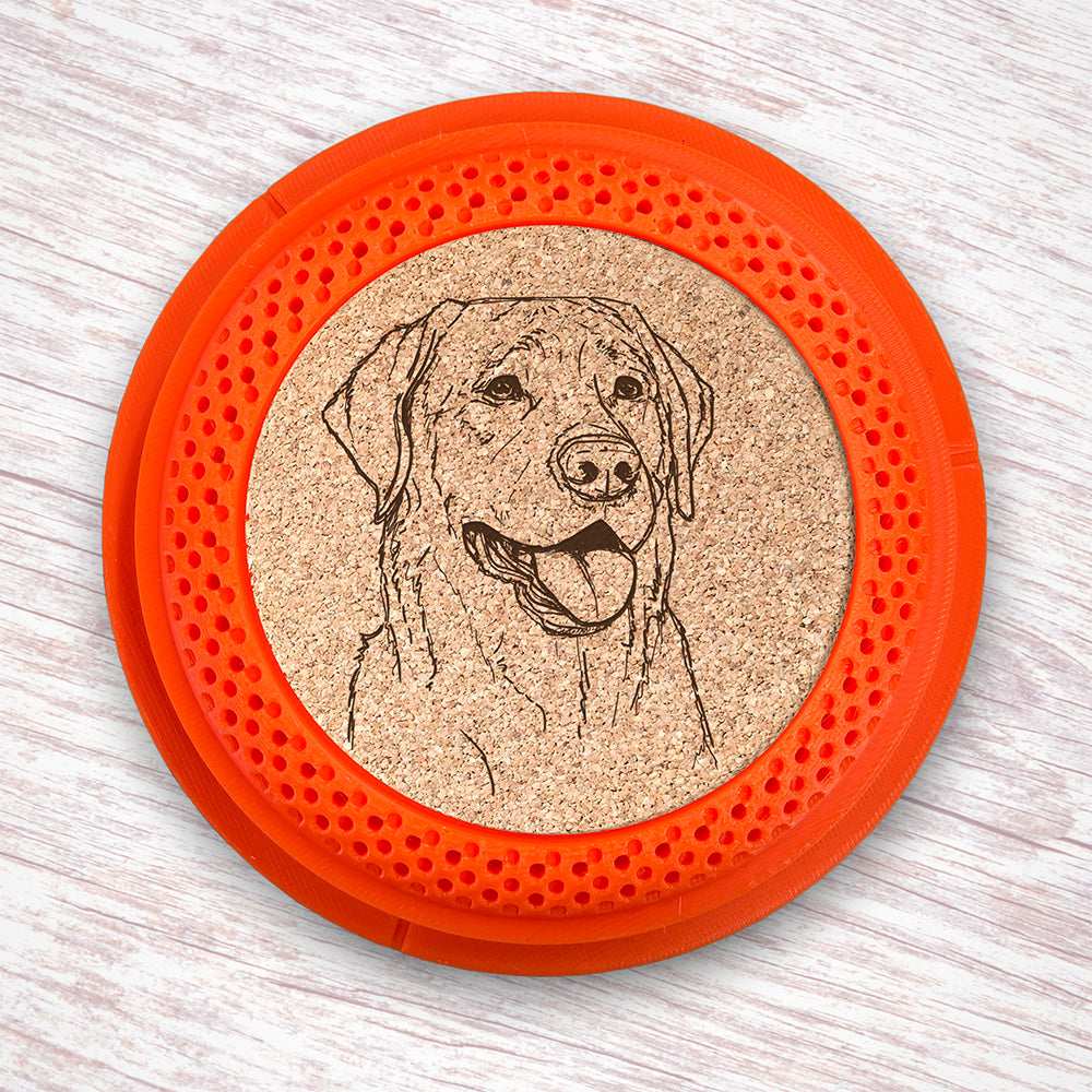 Clay Pigeon shaped coaster base with a laser-engraved cork insert featuring a Labrador Retriever - this set of 4 coasters makes a unique gift for any trap shooter, gun enthusiast and bird dog lover! By Muggins Gifts for the Dakota Pheasant Guide Souvenir shop.