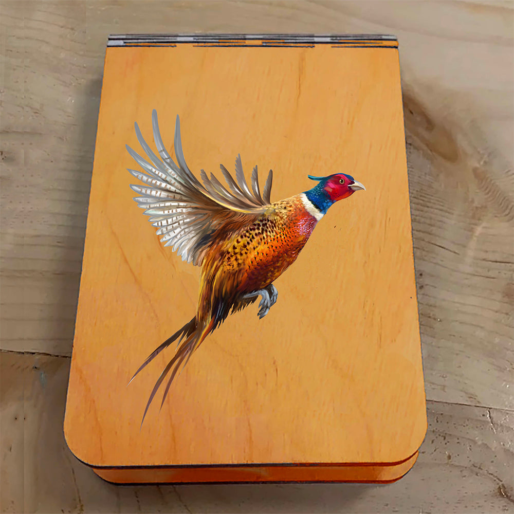 Featuring a colorful painting of a Pheasant taking flight, this small wooden crib board is an ideal gift and travel companion for any game bird and hunting enthusiast. Enjoy hours of fun on the go, and make your next adventure memorable with our Travel Crib Board! A Dakota Pheasant Guide souvenir.